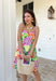 This sleeveless floral dress is bringing all the color and all the confidence. Featuring a bold mix of purple, orange, green, yellow, pink, and white, this beauty is made to stand out in the best way. The scalloped neckline and hem add the sweetest feminine touch, while the fabric-covered knotted bead straps give it that extra detail that feels fun and elevated. Designed with smocking along the back for a comfortable, flattering fit, this fully lined cotton dress is as easy to wear as it is eye-catching. 
