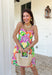 This sleeveless floral dress is bringing all the color and all the confidence. Featuring a bold mix of purple, orange, green, yellow, pink, and white, this beauty is made to stand out in the best way. The scalloped neckline and hem add the sweetest feminine touch, while the fabric-covered knotted bead straps give it that extra detail that feels fun and elevated. Designed with smocking along the back for a comfortable, flattering fit, this fully lined cotton dress is as easy to wear as it is eye-catching. 