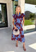 Embrace the beauty of the season in this stunning wine floral midi dress. Featuring a gorgeous blue and white floral print, this feminine dress is perfect for everything on your fall calendar. The self-tie belt cinches the waist for a flattering silhouette, while the ruffle sleeves and ruffle hem add soft movement and romantic charm. Finished with a button-down front, side pockets, and a fully lined design, this timeless cotton dress.