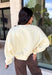 Stay cozy while showing off your love for the outdoors with this fun graphic sweatshirt from Poppy &amp; Pine. Designed in a classic white hue, this fleece-lined pullover features a charming mallard duck graphic across the front for the perfect blend of playful style and everyday comfort. The ultra-soft interior keeps you warm on crisp fall days, while the ribbed neckline, cuffs, and hem create a timeless fit you'll love.