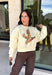 Stay cozy while showing off your love for the outdoors with this fun graphic sweatshirt from Poppy &amp; Pine. Designed in a classic white hue, this fleece-lined pullover features a charming mallard duck graphic across the front for the perfect blend of playful style and everyday comfort. The ultra-soft interior keeps you warm on crisp fall days, while the ribbed neckline, cuffs, and hem create a timeless fit you'll love.