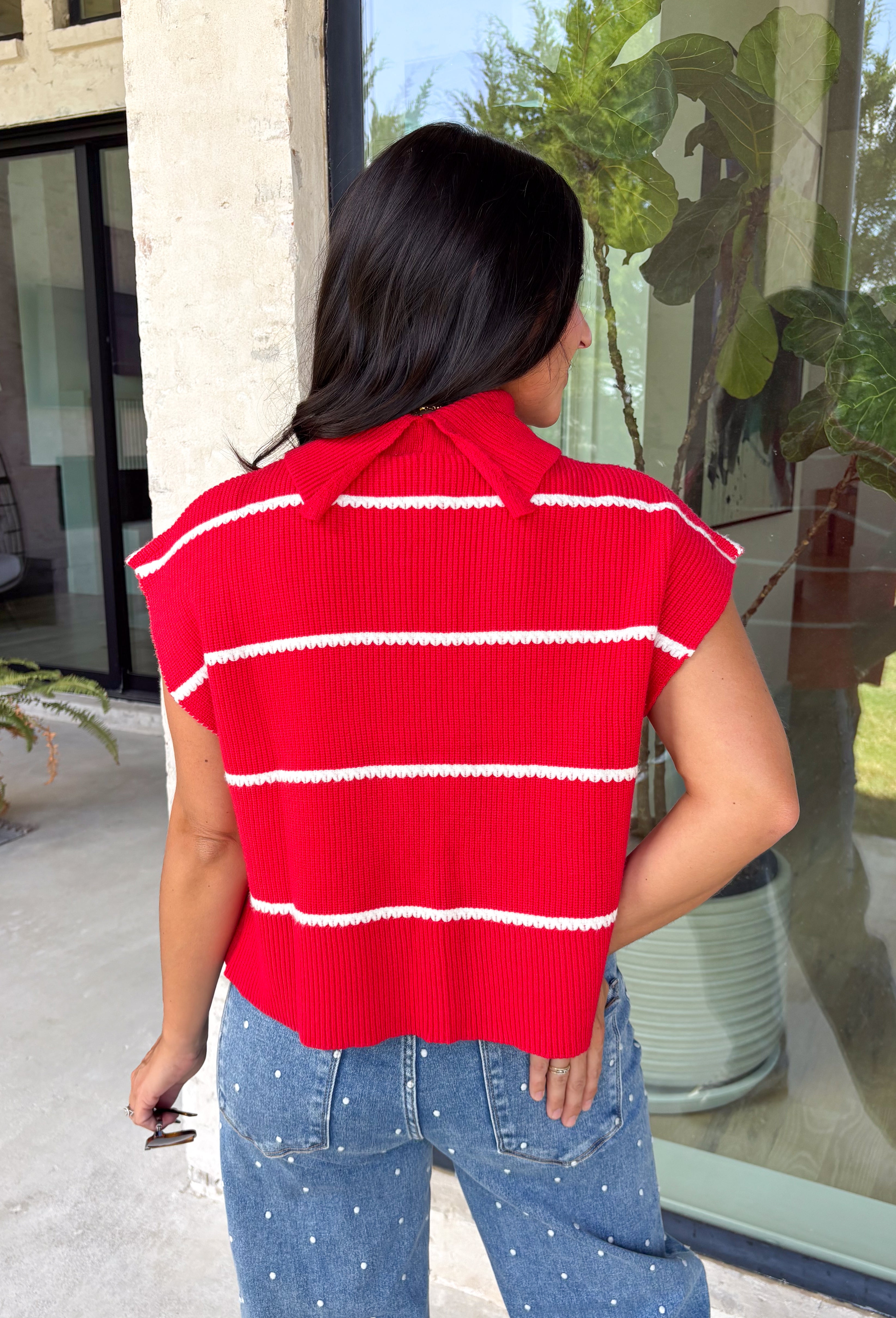 Bring timeless style and cozy comfort to your fall wardrobe with this classic sweater from Day + Moon. Designed in a vibrant red knit with crisp white stripes, this short sleeve sweater is the perfect blend of polished and playful. The cozy turtleneck adds warmth for cooler days, while the soft knit fabric makes it comfortable enough for all-day wear. Whether you're headed to work, a football game, or a weekend coffee date, this versatile sweater is an easy favorite for the season.