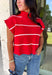 Bring timeless style and cozy comfort to your fall wardrobe with this classic sweater from Day + Moon. Designed in a vibrant red knit with crisp white stripes, this short sleeve sweater is the perfect blend of polished and playful. The cozy turtleneck adds warmth for cooler days, while the soft knit fabric makes it comfortable enough for all-day wear. Whether you're headed to work, a football game, or a weekend coffee date, this versatile sweater is an easy favorite for the season.
