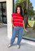 Bring timeless style and cozy comfort to your fall wardrobe with this classic sweater from Day + Moon. Designed in a vibrant red knit with crisp white stripes, this short sleeve sweater is the perfect blend of polished and playful. The cozy turtleneck adds warmth for cooler days, while the soft knit fabric makes it comfortable enough for all-day wear. Whether you're headed to work, a football game, or a weekend coffee date, this versatile sweater is an easy favorite for the season.