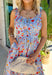 This sleeveless light blue midi dress by Entro is giving major spring picnic energy. With a colorful floral print in pops of red, mustard, and light pink, it’s bright, cheerful, and made for sunny days. The blue and white gingham trim along the top adds the cutest contrast, and the three front tie details bring in that extra sweet, feminine touch we can’t get enough of. 