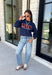 Bring a little extra luck to your cozy season with this playful graphic sweatshirt. Featuring "Lucky" in rust lettering accented with whimsical stars and outlined by a light blue circle, this navy pullover adds the perfect pop of color to your everyday wardrobe. The fleece-lined interior keeps you warm and comfortable, making it the perfect choice for football weekends, coffee runs, casual days, and cozy nights in. It's an easy favorite you'll be reaching for all fall and winter long.