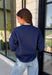 Bring a little extra luck to your cozy season with this playful graphic sweatshirt. Featuring "Lucky" in rust lettering accented with whimsical stars and outlined by a light blue circle, this navy pullover adds the perfect pop of color to your everyday wardrobe. The fleece-lined interior keeps you warm and comfortable, making it the perfect choice for football weekends, coffee runs, casual days, and cozy nights in. It's an easy favorite you'll be reaching for all fall and winter long.