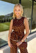 Bring a playful print into your fall wardrobe with this brown and cream polka dot top from Entro. The warm brown background and classic cream dots make it easy to pair with all the rich neutrals of the season, while the contrast trim adds an extra touch of detail. A self-tie at the waist lets you adjust the shape, and the elasticated back waist keeps the fit comfortable throughout the day. 