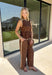 Bring a playful print into your fall wardrobe with this brown and cream polka dot top from Entro. The warm brown background and classic cream dots make it easy to pair with all the rich neutrals of the season, while the contrast trim adds an extra touch of detail. A self-tie at the waist lets you adjust the shape, and the elasticated back waist keeps the fit comfortable throughout the day. 