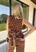 Bring a playful print into your fall wardrobe with this brown and cream polka dot top from Entro. The warm brown background and classic cream dots make it easy to pair with all the rich neutrals of the season, while the contrast trim adds an extra touch of detail. A self-tie at the waist lets you adjust the shape, and the elasticated back waist keeps the fit comfortable throughout the day. 