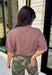 The perfect layering piece has arrived just in time for sweater weather. This chocolate brown cardigan is crafted from a soft sweater knit that makes every outfit feel a little cozier while still looking effortlessly polished. The button-front design gives you endless styling options—wear it buttoned as a top or layered over your favorite tanks and dresses. Finished with exposed hems and classic ribbed trim, this versatile cardigan is one you'll reach for from crisp fall mornings through the holiday season.