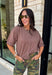The perfect layering piece has arrived just in time for sweater weather. This chocolate brown cardigan is crafted from a soft sweater knit that makes every outfit feel a little cozier while still looking effortlessly polished. The button-front design gives you endless styling options—wear it buttoned as a top or layered over your favorite tanks and dresses. Finished with exposed hems and classic ribbed trim, this versatile cardigan is one you'll reach for from crisp fall mornings through the holiday season.