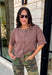 The perfect layering piece has arrived just in time for sweater weather. This chocolate brown cardigan is crafted from a soft sweater knit that makes every outfit feel a little cozier while still looking effortlessly polished. The button-front design gives you endless styling options—wear it buttoned as a top or layered over your favorite tanks and dresses. Finished with exposed hems and classic ribbed trim, this versatile cardigan is one you'll reach for from crisp fall mornings through the holiday season.