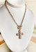 Classic with a modern edge, this matte gold chain necklace is designed with a pearl cross pendant and toggle clasp for a timeless finish. Measuring approximately 15" with a 3" extender, it’s the perfect length for layering or wearing on its own. Whether styled with casual looks or dressier outfits, this piece adds a touch of elegance that works for any occasion.