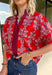 Warm autumn tones and effortless style come together in this beautiful abstract print top. Designed in a rich brick hue with an eye-catching abstract pattern, this lightweight cotton blouse is the perfect blend of classic and contemporary. The contrast neckline adds a polished touch to the flattering v-neckline, while the puff sleeves with elastic cuffs create a feminine silhouette that's easy to dress up or down. 