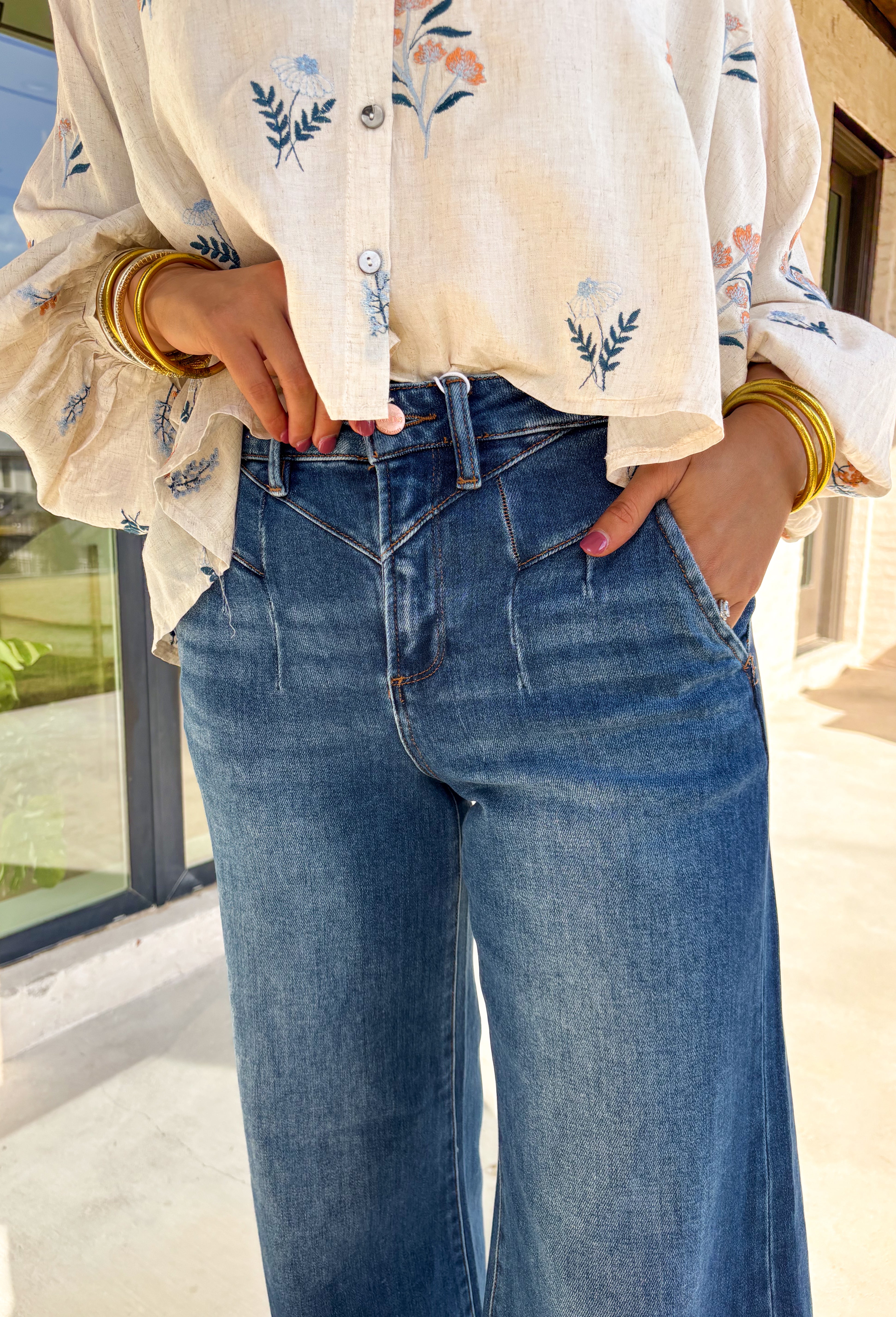 Refresh your denim collection for spring with these dark wash wide leg jeans by Risen. Designed with a flattering high-rise fit and front yoke seam detail, these jeans bring a modern edge to a timeless silhouette. The soft stretch denim and 31" inseam make them perfect for pairing with lightweight blouses, floral tops, or easy tees as the weather warms up.