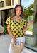 This lime polka dot top is the perfect blend of timeless and on-trend! The classic navy polka dot print never goes out of style, while the statement sleeves add a fashion-forward touch that instantly elevates your look. Crafted from breathable cotton, it's lightweight enough to wear now and easy to layer under jackets and cardigans as the seasons change. Whether you're heading to the office, meeting friends for lunch, or dressing up your favorite denim, this top makes looking polished feel effortless.
