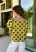 This lime polka dot top is the perfect blend of timeless and on-trend! The classic navy polka dot print never goes out of style, while the statement sleeves add a fashion-forward touch that instantly elevates your look. Crafted from breathable cotton, it's lightweight enough to wear now and easy to layer under jackets and cardigans as the seasons change. Whether you're heading to the office, meeting friends for lunch, or dressing up your favorite denim, this top makes looking polished feel effortless.