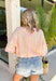 This colorful textured top is the kind of easy, throw-on piece that makes summer dressing fun! With a mix of pink, white, and yellow, it brings a pop of color that feels bright but still easy to style. The waffle texture adds dimension, while the pink trim along the neckline, sleeves, and hem gives it that extra standout detail. Finished with a front pocket for a casual touch, this top is perfect for everyday wear—from errands to coffee runs. Pair it with denim shorts or white jeans and you’re set. 
