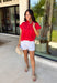 Bold, feminine, and perfect for sunny days! This red short sleeve button down top features beautiful eyelet lace throughout, adding texture and charm to a classic silhouette. The vibrant color makes it an instant standout while the breathable cotton fabric keeps it comfortable and easy to wear. Designed with a collared neckline and full button front, this top blends timeless structure with delicate detail. It’s polished enough to dress up but still relaxed enough for everyday styling.
