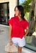 Bold, feminine, and perfect for sunny days! This red short sleeve button down top features beautiful eyelet lace throughout, adding texture and charm to a classic silhouette. The vibrant color makes it an instant standout while the breathable cotton fabric keeps it comfortable and easy to wear. Designed with a collared neckline and full button front, this top blends timeless structure with delicate detail. It’s polished enough to dress up but still relaxed enough for everyday styling.