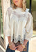 Delicate details and timeless style come together beautifully in this romantic boho-inspired blouse. Crafted from soft cream cotton, this feminine top is adorned with intricate crochet lace throughout, creating a look that's effortlessly elegant while still feeling easy to wear. The high ruffle neckline and scalloped lace accents along the yoke, sleeves, and hem add beautiful texture and vintage-inspired charm, while the keyhole button closure at the back completes the look with a graceful finishing touch. 
