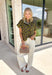 Bring a whimsical touch to your fall wardrobe with this beautifully printed butterfly blouse. Designed in a rich olive green with a striking black butterfly print, this lightweight cotton top offers the perfect balance of playful and polished. The subtle ruffle neckline adds a soft feminine touch, while the button-front detail gives it a timeless feel that's easy to dress up or down.