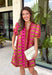 Make a statement this season in this beautifully detailed dress from Entro. Featuring a unique mix of stripes and polka dots in rich shades of plum, burgundy, and olive, this eye-catching dress is full of playful charm with a timeless feel. The flattering v-neckline is accented with decorative front button details, while contrast trim adds an extra touch of personality. 