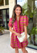 Make a statement this season in this beautifully detailed dress from Entro. Featuring a unique mix of stripes and polka dots in rich shades of plum, burgundy, and olive, this eye-catching dress is full of playful charm with a timeless feel. The flattering v-neckline is accented with decorative front button details, while contrast trim adds an extra touch of personality. 