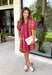 Make a statement this season in this beautifully detailed dress from Entro. Featuring a unique mix of stripes and polka dots in rich shades of plum, burgundy, and olive, this eye-catching dress is full of playful charm with a timeless feel. The flattering v-neckline is accented with decorative front button details, while contrast trim adds an extra touch of personality. 