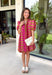 Make a statement this season in this beautifully detailed dress from Entro. Featuring a unique mix of stripes and polka dots in rich shades of plum, burgundy, and olive, this eye-catching dress is full of playful charm with a timeless feel. The flattering v-neckline is accented with decorative front button details, while contrast trim adds an extra touch of personality. 