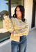Nothing completes a fall outfit quite like a cozy cardigan. This off white button down cardigan features warm mustard stripes that bring the perfect touch of autumn charm to your wardrobe. The timeless button front makes it easy to wear open or closed, giving you endless styling possibilities throughout the season. Whether you're heading to the office, enjoying a coffee date, or spending the weekend at the pumpkin patch, this soft knit cardigan is one you'll be reaching for again and again.