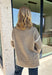 Cozy season calls for an easy sweater you can throw on and instantly feel ready for the day. This light mocha knit sweater from Mable features cream trim throughout, giving the warm neutral color a fresh contrast that stands out without being too bold. The oversized fit creates that relaxed, cozy feel we love for crisp mornings, coffee runs, and laid-back weekends. 