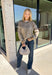 Cozy season calls for an easy sweater you can throw on and instantly feel ready for the day. This light mocha knit sweater from Mable features cream trim throughout, giving the warm neutral color a fresh contrast that stands out without being too bold. The oversized fit creates that relaxed, cozy feel we love for crisp mornings, coffee runs, and laid-back weekends. 