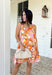 Make an entrance in this bold abstract print dress that was made for sunny days and standout moments. With vibrant shades of orange, pink, tan, black, yellow, and white throughout, this sleeveless beauty feels like wearable art. The orange scallop trim along the neckline and pink scallop trim at the hem add the sweetest contrast, giving it that extra pop of personality. Lightweight and fully lined for easy wear.