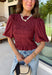 Rich autumn color and feminine details come together beautifully in this brick peplum top. Designed with a flattering smocked bodice, this top offers a comfortable fit while creating a timeless silhouette you'll love. The delicate ruffle neckline and ruffle hem add just the right amount of charm, while the puff sleeves complete the look with a classic fall feel. 