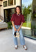 Rich autumn color and feminine details come together beautifully in this brick peplum top. Designed with a flattering smocked bodice, this top offers a comfortable fit while creating a timeless silhouette you'll love. The delicate ruffle neckline and ruffle hem add just the right amount of charm, while the puff sleeves complete the look with a classic fall feel. 
