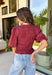 Rich autumn color and feminine details come together beautifully in this brick peplum top. Designed with a flattering smocked bodice, this top offers a comfortable fit while creating a timeless silhouette you'll love. The delicate ruffle neckline and ruffle hem add just the right amount of charm, while the puff sleeves complete the look with a classic fall feel. 