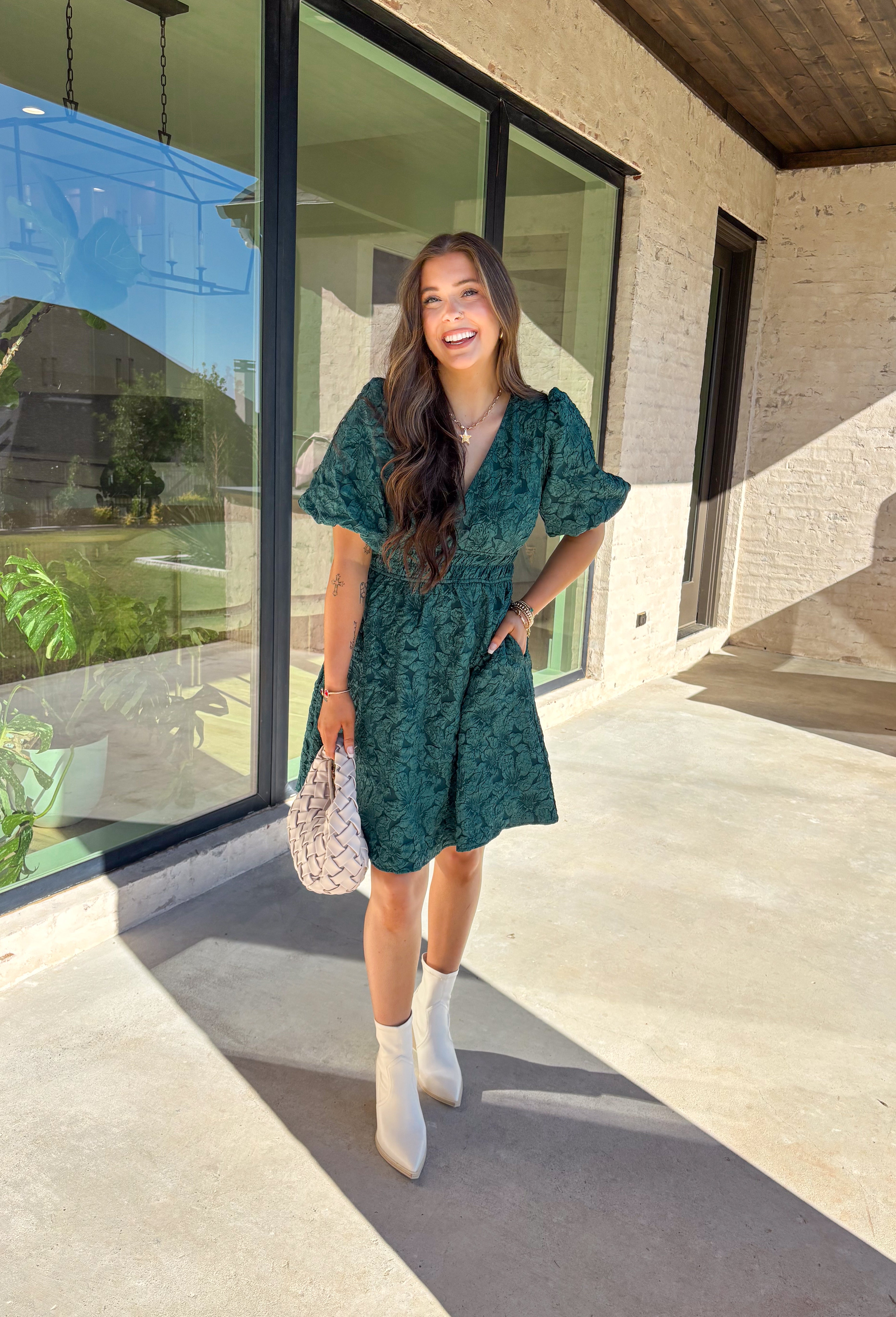 This green short sleeve dress by She + Sky brings an elegant touch to your wardrobe with its monochromatic floral texture that gives a lace-like look—perfect for the holiday season. The puff sleeves and elastic waist create a flattering, feminine silhouette, while the fully lined design ensures comfort from dinner parties to festive gatherings. It’s a chic, effortless piece you’ll reach for all winter long.
