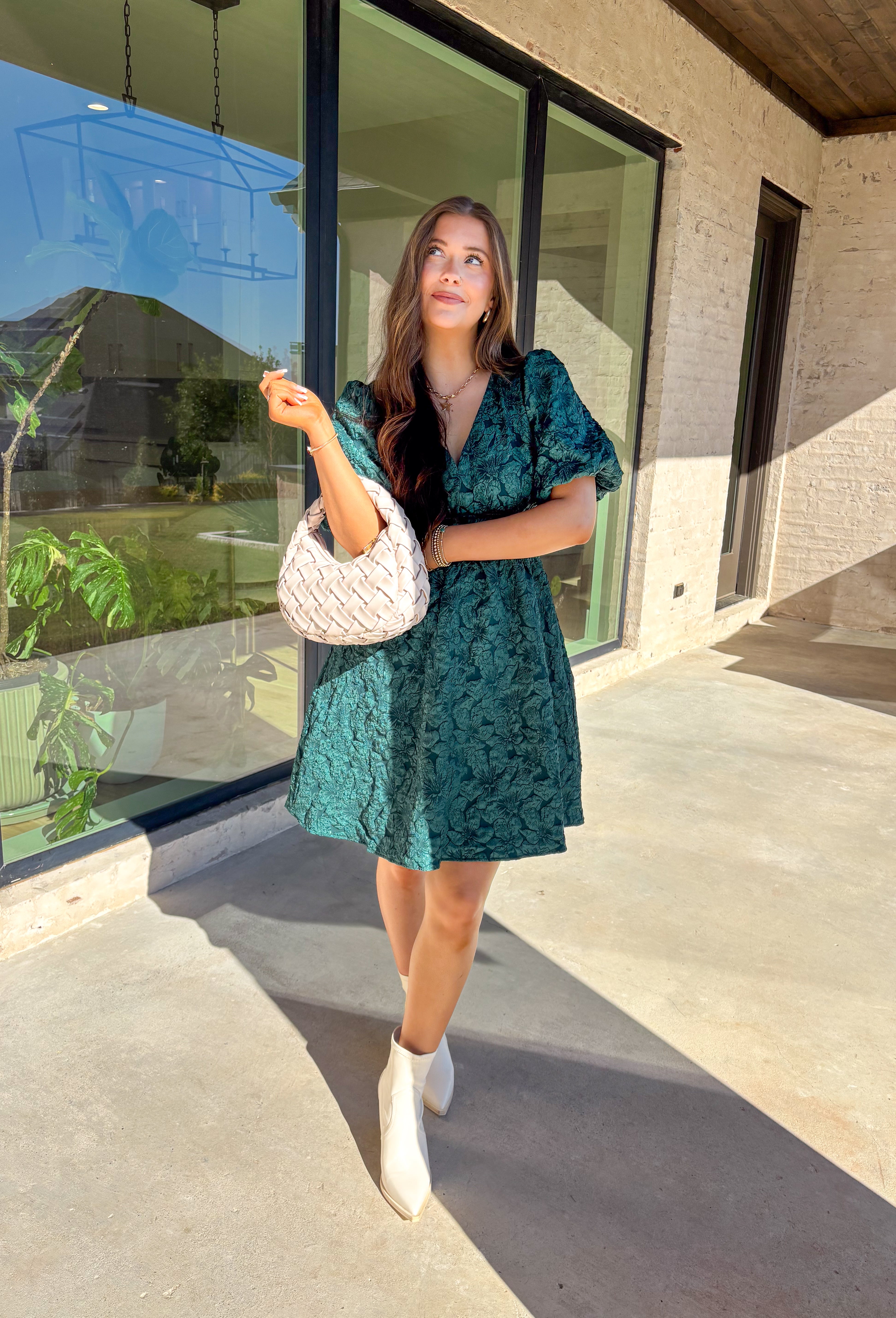 This green short sleeve dress by She + Sky brings an elegant touch to your wardrobe with its monochromatic floral texture that gives a lace-like look—perfect for the holiday season. The puff sleeves and elastic waist create a flattering, feminine silhouette, while the fully lined design ensures comfort from dinner parties to festive gatherings. It’s a chic, effortless piece you’ll reach for all winter long.