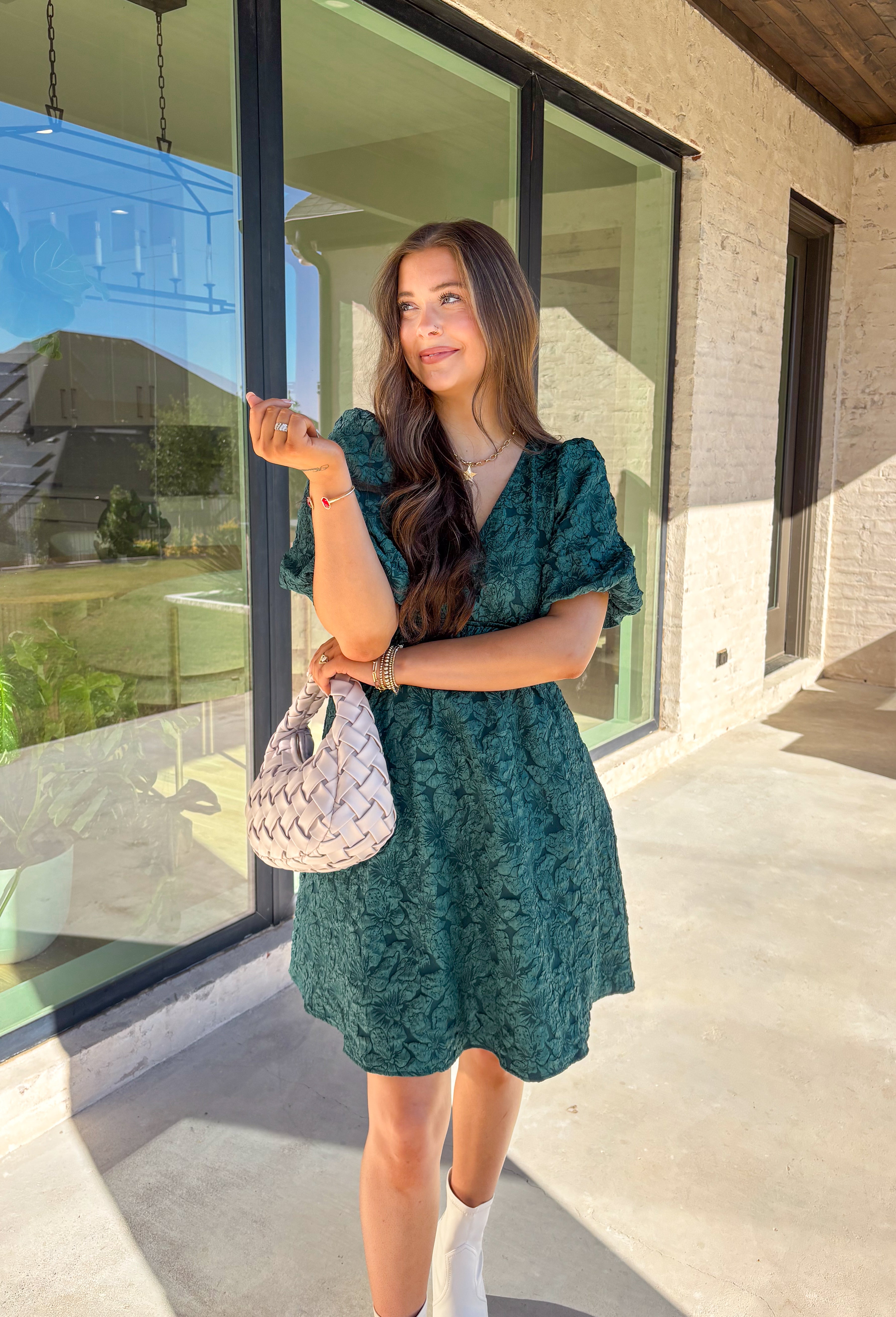 This green short sleeve dress by She + Sky brings an elegant touch to your wardrobe with its monochromatic floral texture that gives a lace-like look—perfect for the holiday season. The puff sleeves and elastic waist create a flattering, feminine silhouette, while the fully lined design ensures comfort from dinner parties to festive gatherings. It’s a chic, effortless piece you’ll reach for all winter long.