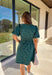 This green short sleeve dress by She + Sky brings an elegant touch to your wardrobe with its monochromatic floral texture that gives a lace-like look—perfect for the holiday season. The puff sleeves and elastic waist create a flattering, feminine silhouette, while the fully lined design ensures comfort from dinner parties to festive gatherings. It’s a chic, effortless piece you’ll reach for all winter long.