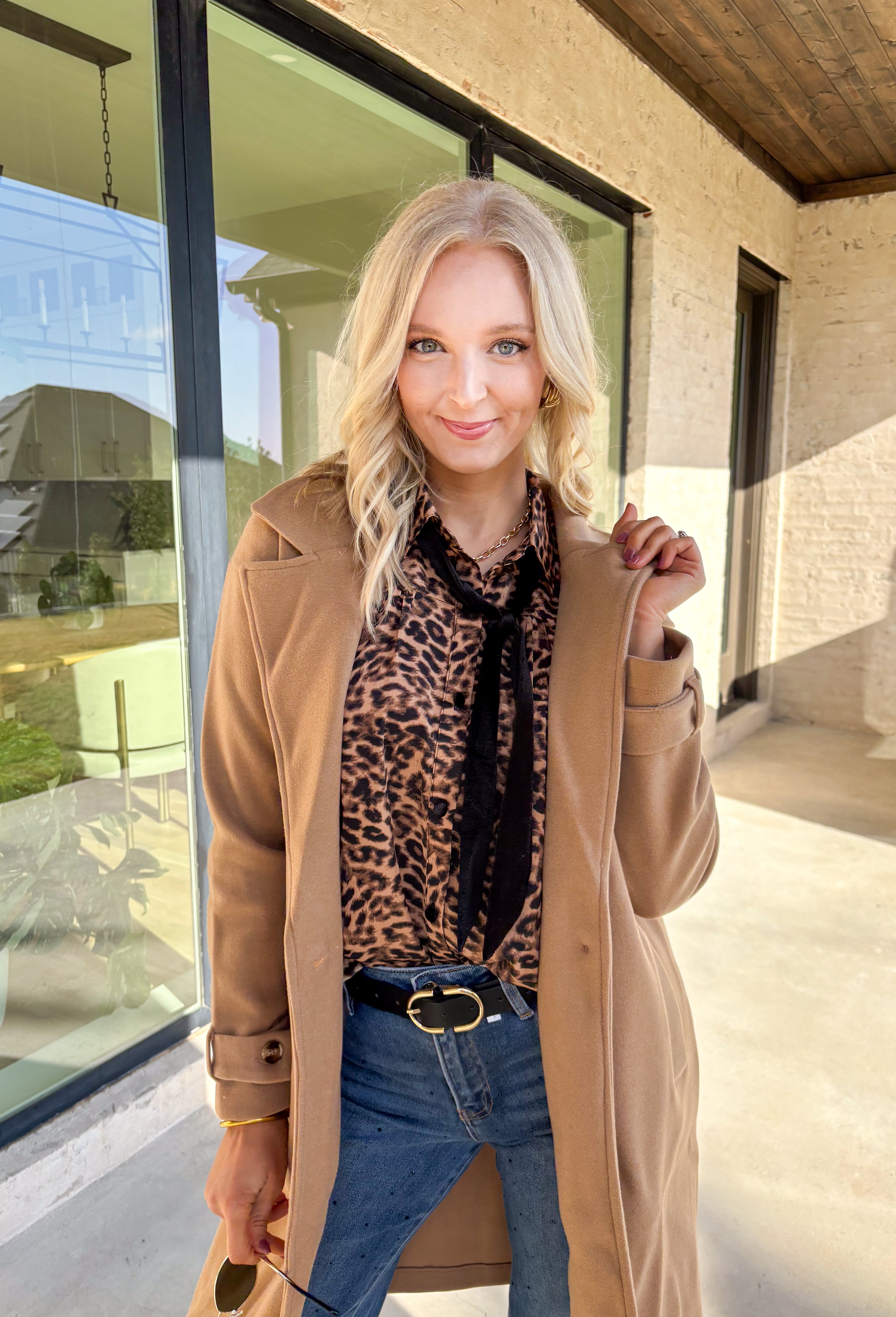 Timeless and cozy, this camel trench coat jacket by Haute Monde is a cold-weather essential you’ll reach for again and again. With a classic button front and side pockets, this piece brings effortless polish to any winter outfit. The soft fabric and tailored silhouette make it perfect for layering over chunky knits or dresses on chilly days.