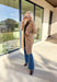 Timeless and cozy, this camel trench coat jacket by Haute Monde is a cold-weather essential you’ll reach for again and again. With a classic button front and side pockets, this piece brings effortless polish to any winter outfit. The soft fabric and tailored silhouette make it perfect for layering over chunky knits or dresses on chilly days.