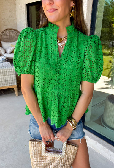 This green eyelet top is such a fresh and feminine pick for summer! The intricate eyelet embroidery adds the prettiest texture, while the puff sleeves and elastic openings create that flattering, easy shape. The ruffled neckline with a soft v-neck adds a touch of charm, and the scalloped hem gives it that extra detail that makes it feel special. Lightweight and breathable in 100% cotton, it’s perfect for warm days when you want to look put together without overthinking it. 