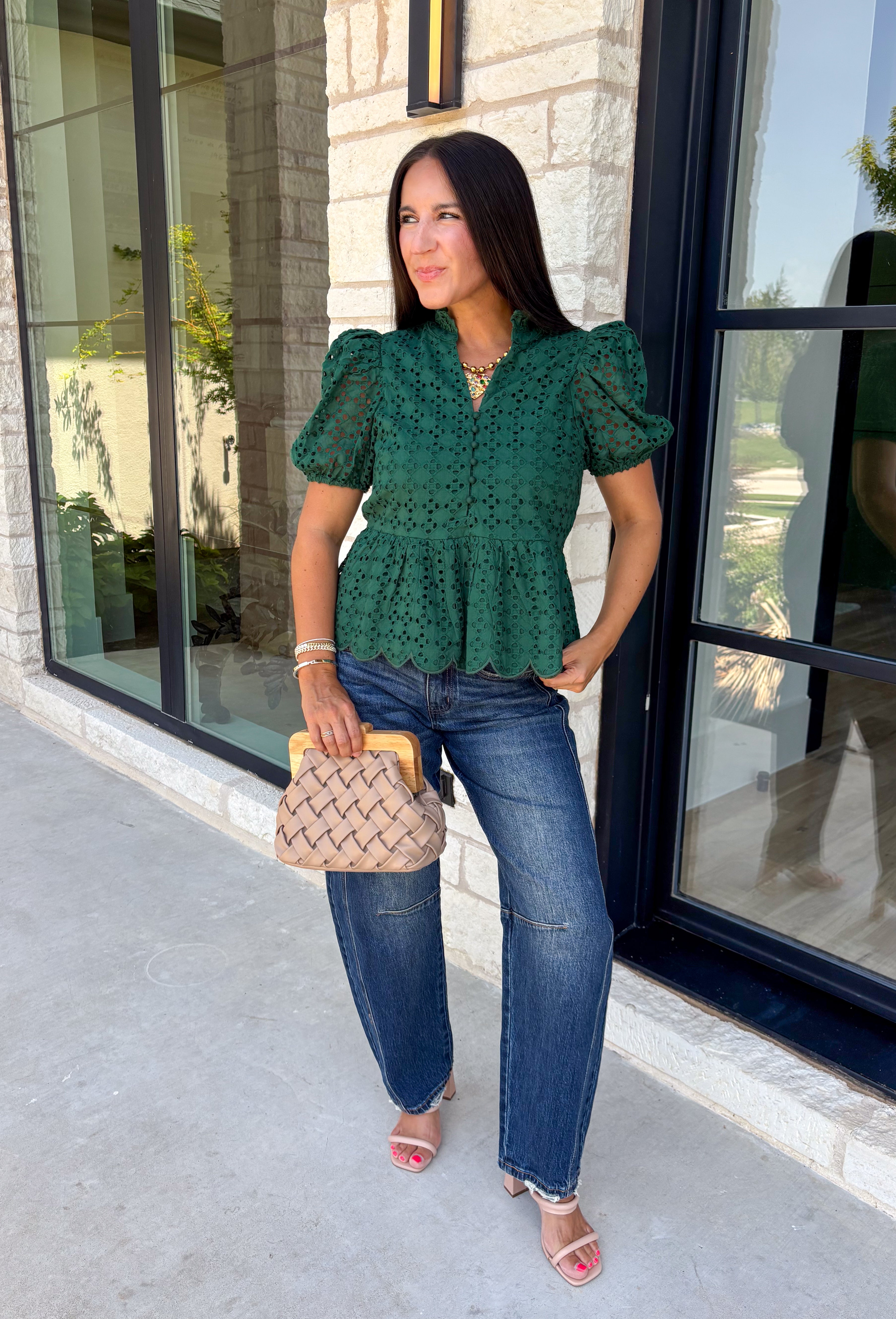 Elevate your fall wardrobe with this beautifully detailed hunter green top! Crafted from breathable cotton, this feminine top features intricate eyelet embroidery that adds timeless texture and charm. The ruffled accent neckline and flattering v-neck create an effortlessly polished look, while the button front and short puff sleeves with elastic cuffs offer both comfort and style. 