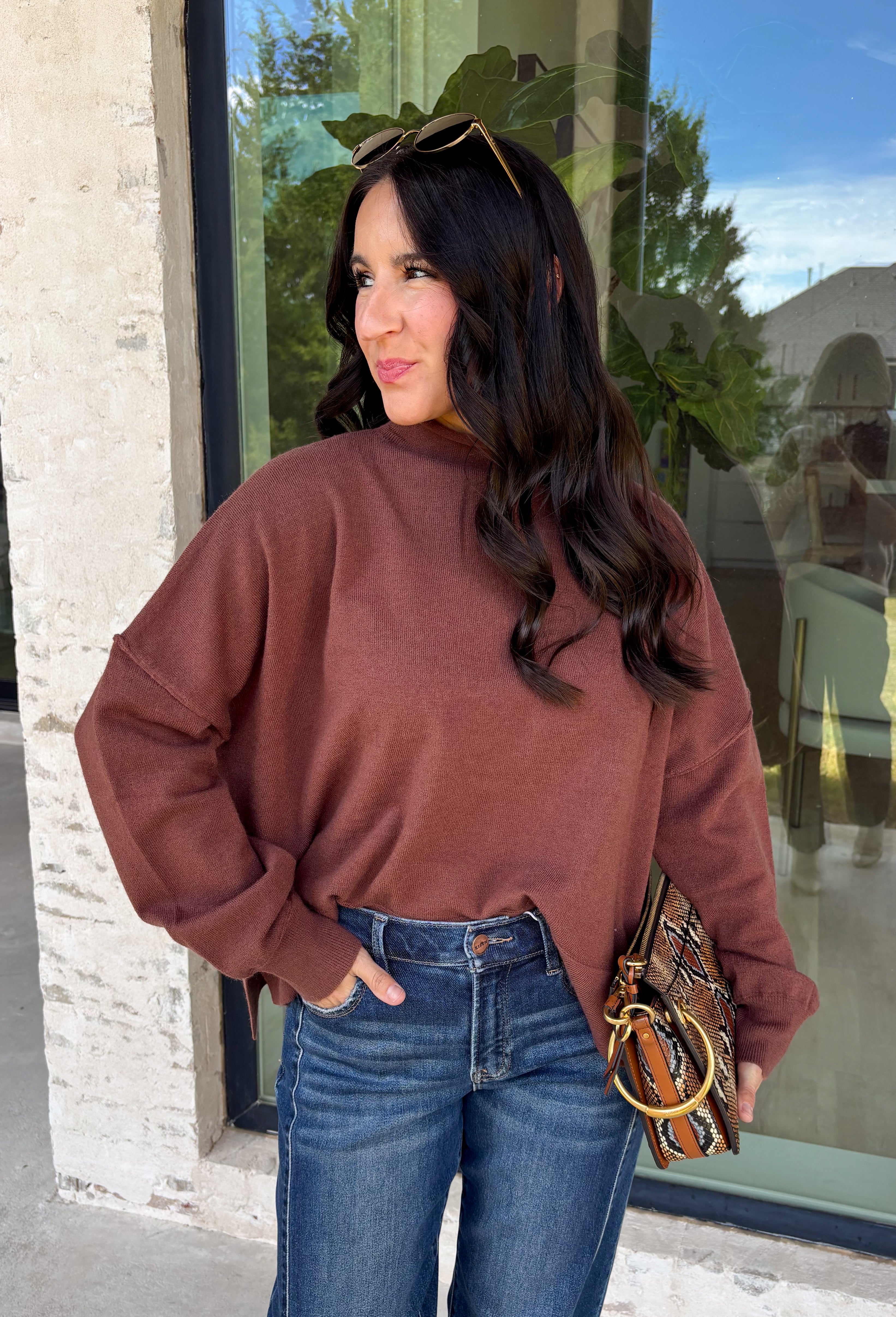 Stay cozy in effortless style with this timeless sweater from Twentifourth. Designed in a rich chocolate brown hue, this lightweight knit is the perfect layering piece for crisp fall mornings and cool evenings. The mock neckline adds a touch of warmth, while the exposed seam detailing gives this classic sweater a modern, lived-in look. Soft, comfortable, and easy to style, it's a versatile staple you'll find yourself reaching for all season long.