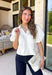 Every wardrobe needs a timeless white denim top, and this one is sure to become a favorite. Crafted from crisp 100% cotton, this classic piece features beautiful tan contrast stitching that adds warmth and dimension to the clean white denim. Feminine puff sleeves give this everyday staple a stylish update, while the collared neckline and front pockets keep the look polished and versatile. You'll find yourself reaching for this top constantly!
