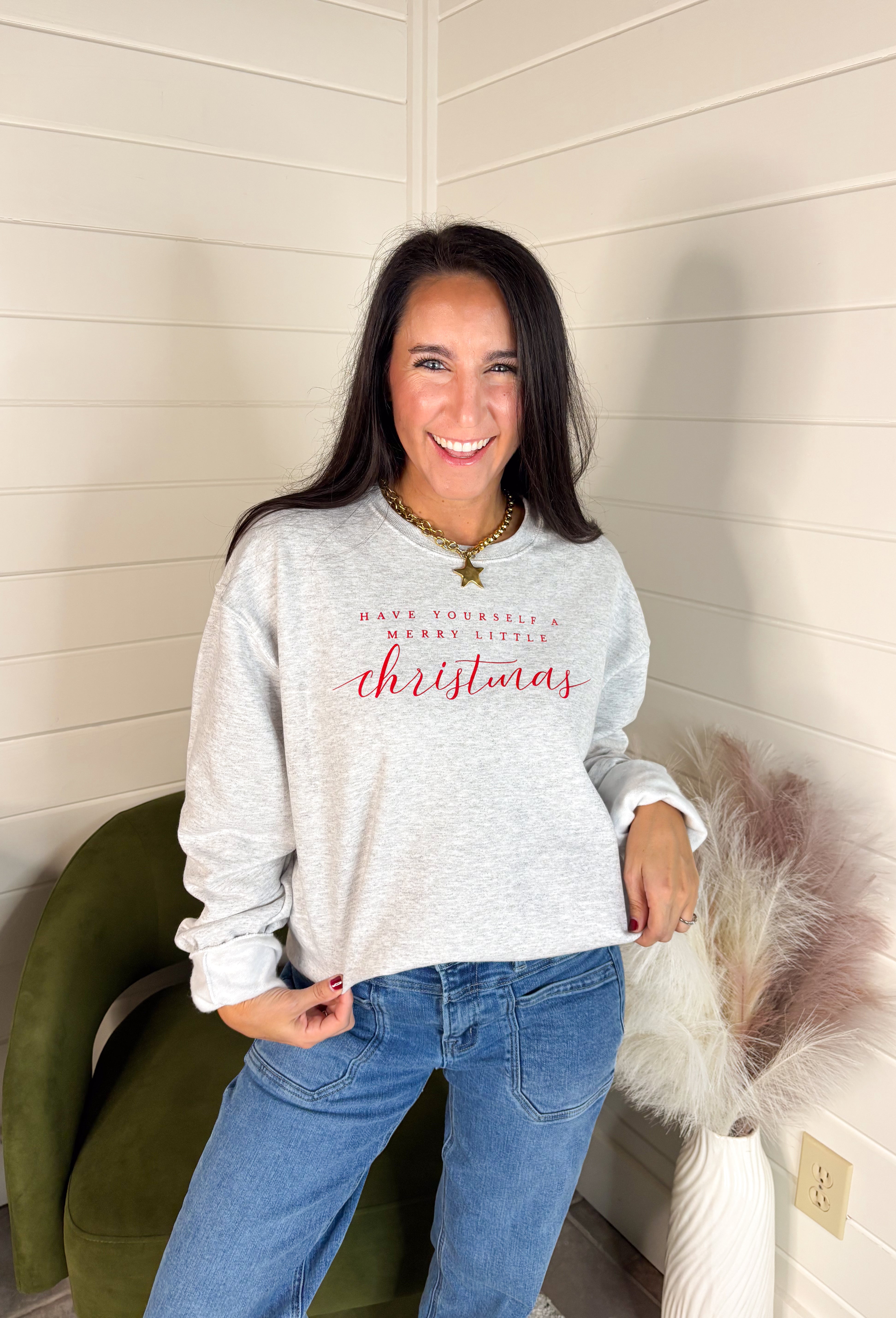 Spread a little holiday cheer with this cozy fleece-lined pullover! Designed in soft light gray with festive red lettering that reads “Have Yourself A Merry Little Christmas,” this sweatshirt is as merry as it is comfortable. Perfect for holiday movie nights, gift wrapping marathons, or sipping cocoa by the tree — it’s the ultimate feel-good piece for the season.