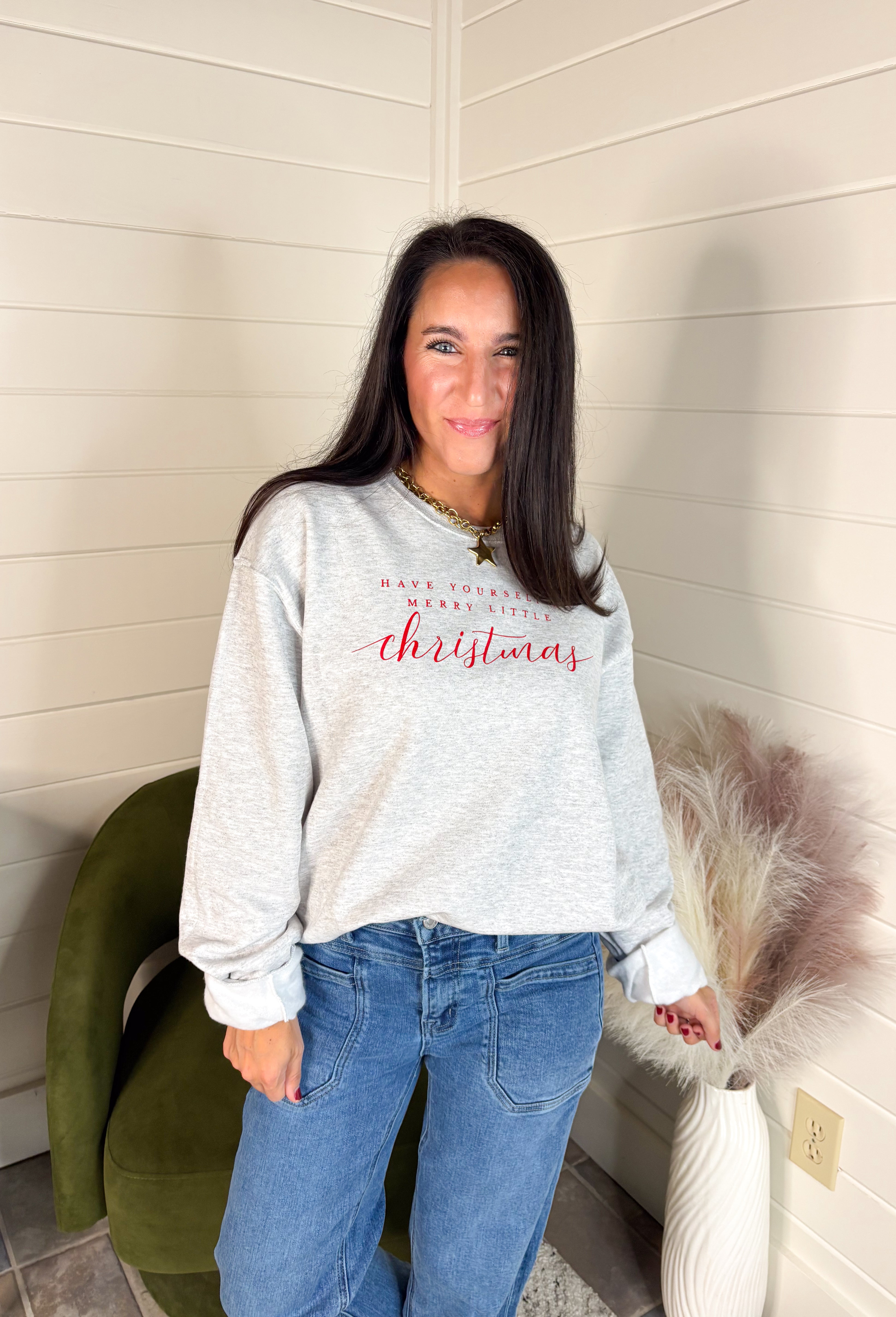 Spread a little holiday cheer with this cozy fleece-lined pullover! Designed in soft light gray with festive red lettering that reads “Have Yourself A Merry Little Christmas,” this sweatshirt is as merry as it is comfortable. Perfect for holiday movie nights, gift wrapping marathons, or sipping cocoa by the tree — it’s the ultimate feel-good piece for the season.